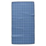 Blue fabric swatch with a repeating grid pattern of intersecting lines.