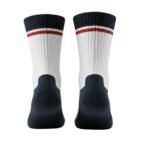 Pair of white crew socks with dark navy cuffs and a red-and-white striped band near the top, shown with navy heel and toe areas.