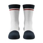 Pair of white crew socks with navy cuffs and a red stripe near the top.