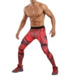 Male basketball player model wearing black compression legging tights and a sleeveless top, standing in a relaxed pose on a plain background.