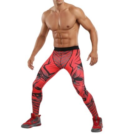 Male basketball player model wearing black compression legging tights and a sleeveless top, standing in a relaxed pose on a plain background.