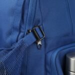 A close-up view of a blue backpack’s side, focusing on a sturdy metal clip and a zipper, with a mesh fabric attachment visible.