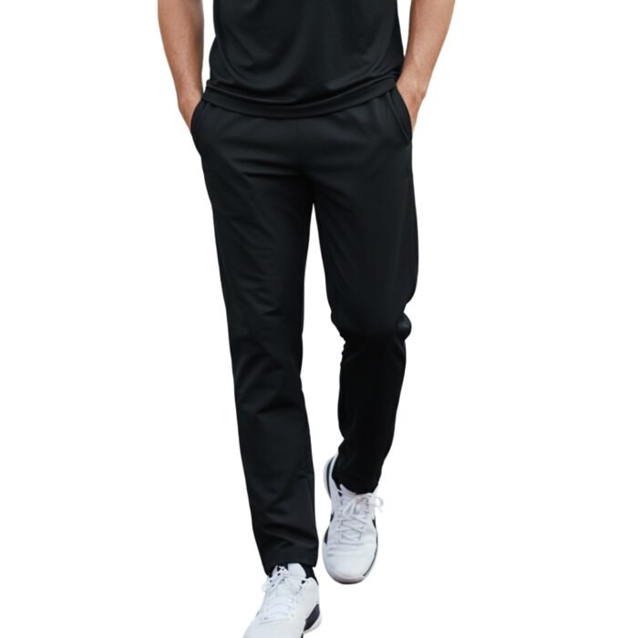 Man in black athletic t-shirt and track pants walking forward on white background — fitness apparel model