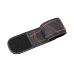 Dark gray basketball wristband sleeve rolled into a loop with orange geometric stitching details on a white background.