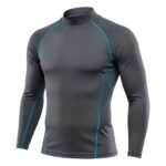 A dark gray long-sleeve athletic shirt with teal stitching accents, designed with a fitted high collar and sleek, form-fitting fabric.