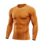 An orange long-sleeve compression shirt with geometric patterns and white seam accents, designed for athletic performance and flexibility.
