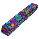 A folded martial arts belt with a vibrant neon dragon and symbol pattern.