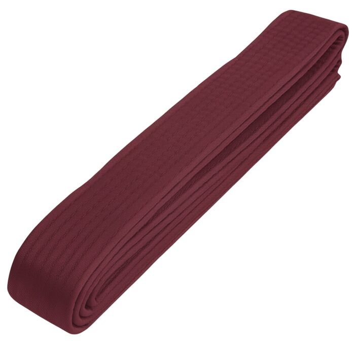 A neatly folded maroon martial arts belt.