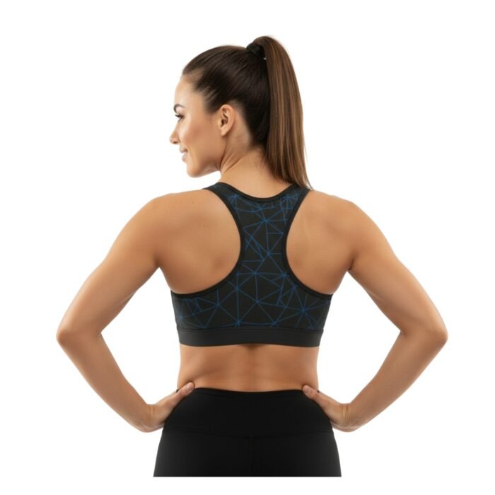 Back view of a person wearing a racerback sports bra with black and blue geometric patterns, hands resting on hips.