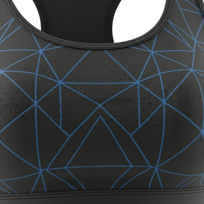 Close-up of black fabric with blue geometric patterns and perforated details on a sports bra.