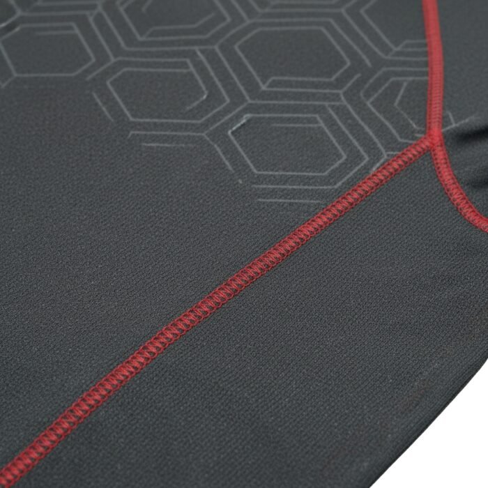 Close-up of gray fabric with a hexagonal pattern and red stitching detail