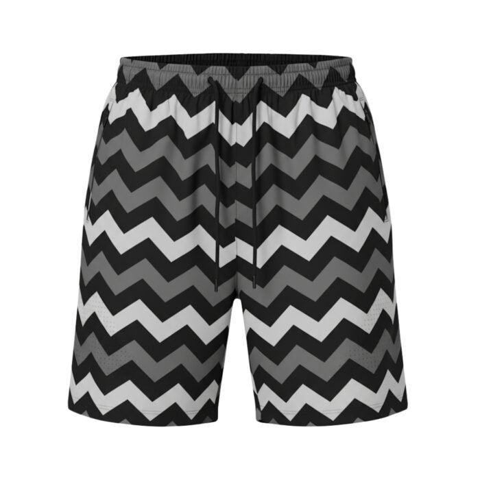 A pair of black, gray, and white zigzag-patterned shorts with an elastic waistband and black drawstring