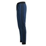 Side view of navy blue track pants with black vertical stripes and a black elastic waistband on a white background