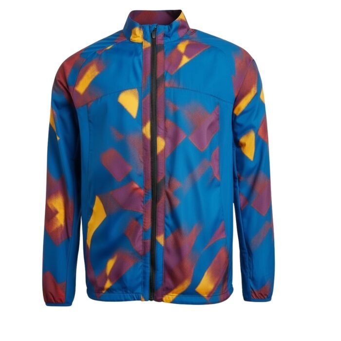 Men's blue rugby jacket with black front zipper, high collar, and vibrant orange and purple streaks in a haphazard pattern, photographed on a studio background