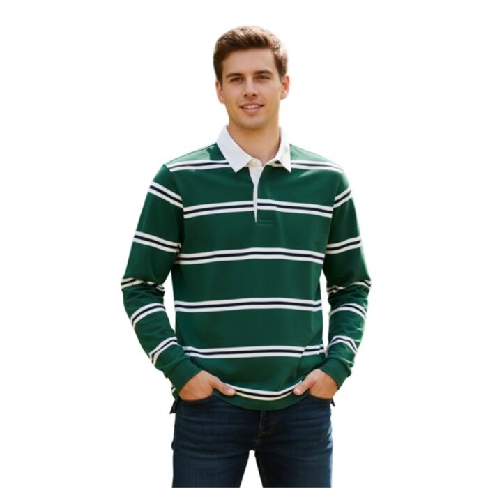 A smiling man in a green-and-white striped long-sleeve polo shirt with white collar and three-button placket, wearing dark blue jeans and white sneakers with blue stripes, posed against black background