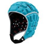Light blue molded rugby headguard with face opening, black interior lining with red pattern, ventilation slots, and chin strap.