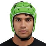 Front view of a neon green molded rugby headguard with a white face frame, black ventilation slot holes, and a black chin strap.