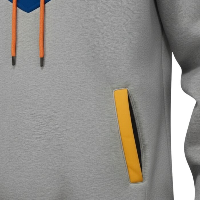 Gray pullover hoodie with a yellow zipper pocket panel detail, shown in a close-up view of the chest area.