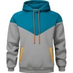 A color-blocked rugby-inspired hoodie with a turquoise upper section (hood and upper chest) and textured gray lower body, shoulders, and sleeves; featuring orange drawstrings, orange-trimmed front pockets, and two vertical gold stripes accenting the pockets.