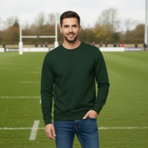 Dark green crewneck sweatshirt with long sleeves and a round neckline on a clean outdoor background