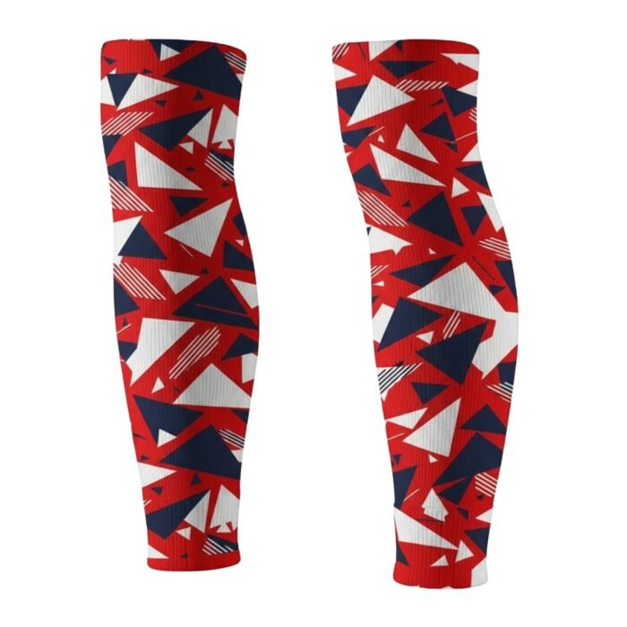 Soccer compression sleeves with sublimated design laid flat on a plain background