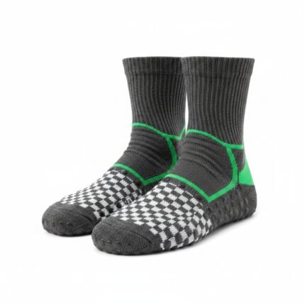 Close-up of soccer grip socks showing the non-slip sole pattern on a plain background.