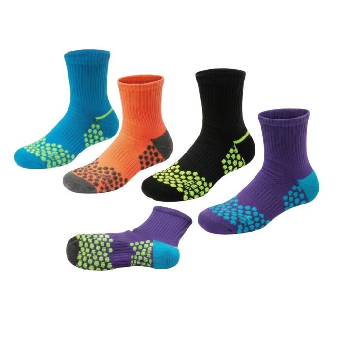 Multiple pairs of soccer grip socks in different colors arranged on a plain background.