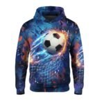 Blue hoodie with centered graphic of a black-and-white soccer ball in motion, surrounded by abstract blue and orange streaks and fragments; textured background blending dark and light blue with geometric shapes.