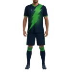 Navy and green soccer kit with a bold lightning-bolt graphic, matching green-trim jersey and shorts.
