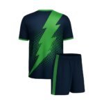 Match-ready soccer kit set featuring a dark navy jersey with vivid green diagonal lightning graphic and dotted side patterning, paired with navy shorts with green side trim.