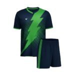 Match-ready soccer kit set featuring a navy jersey with vivid green diagonal lightning-style graphics and dotted patterning, paired with navy shorts with green trim.