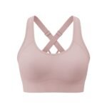 A light pink sports bra with a crisscross back strap design, displayed against a white background.