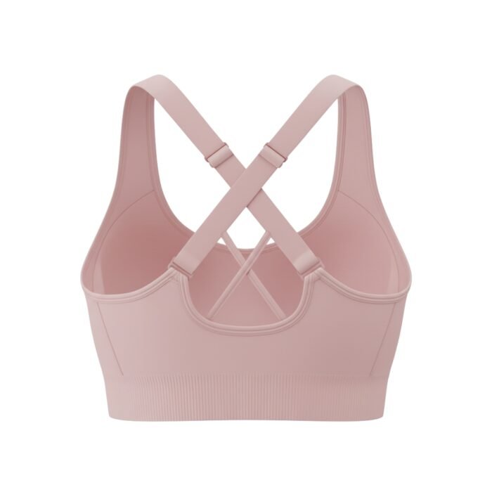 Back view of a light pink sports bra featuring a stylish crisscross strap design.