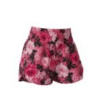 Women’s athletic shorts in pink with black and white floral print and elastic waistband.