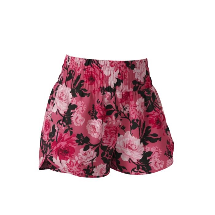Women’s athletic shorts in pink with black and white floral print and elastic waistband.