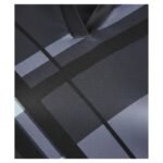 Close-up of a V-neck shirt with a gray and black grid-like geometric pattern on the fabric.