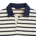 Close-up detail of navy collar and striped body of cream-and-navy rugby polo shirt