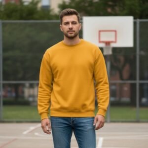 Men’s basketball fleece sweatshirt on male model standing in front of a sporty outdoor background.
