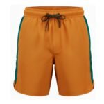 Golden orange men's swim trunks with teal side panels and matte black aglet-tipped drawstring on white background.