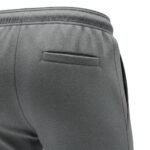 Gray soccer training sweatpants with elastic waistband and tapered athletic fit, featuring a side pocket detail.