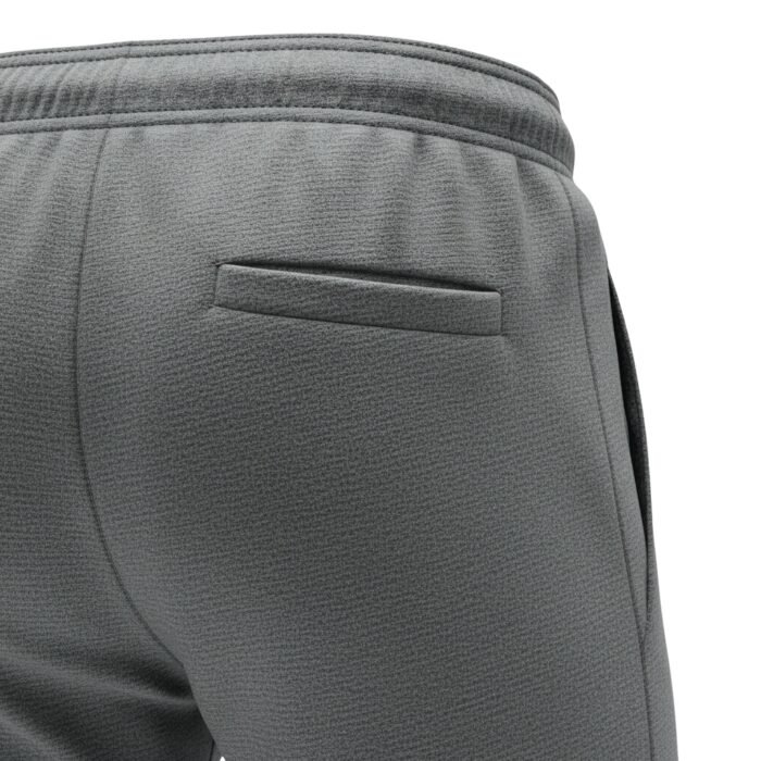 Gray soccer training sweatpants with elastic waistband and tapered athletic fit, featuring a side pocket detail.