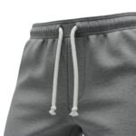 Close-up of black soccer sweatpants waistband with drawstring tied in a bow.