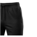 Close-up view of black jogger pants, showcasing the textured fabric, elastic waistband with a drawstring, and a side zipper pocket, against a white background.