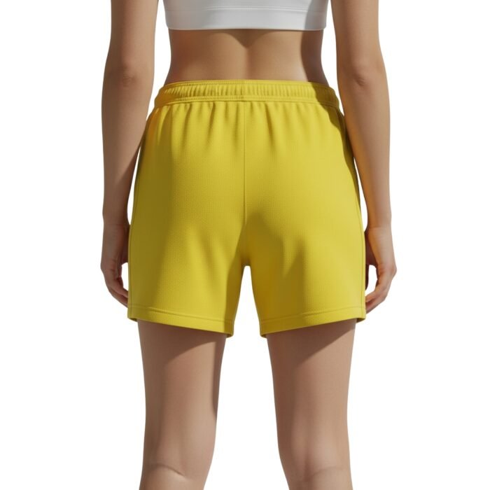 Back view of women’s soccer shorts on a plain background.