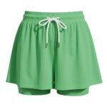 Green women’s soccer skort with elastic waistband and adjustable drawstring tie with built-in shorts