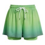 Women’s green soccer skort with elastic drawstring waist and built-in matching shorts