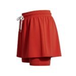 Women’s red soccer skort with a smocked waistband, drawstring tie at the front, and built-in matching shorts underneath.
