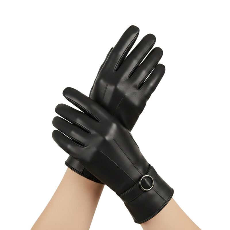 Black women’s leather gloves worn on hands—close-up view on a light background.