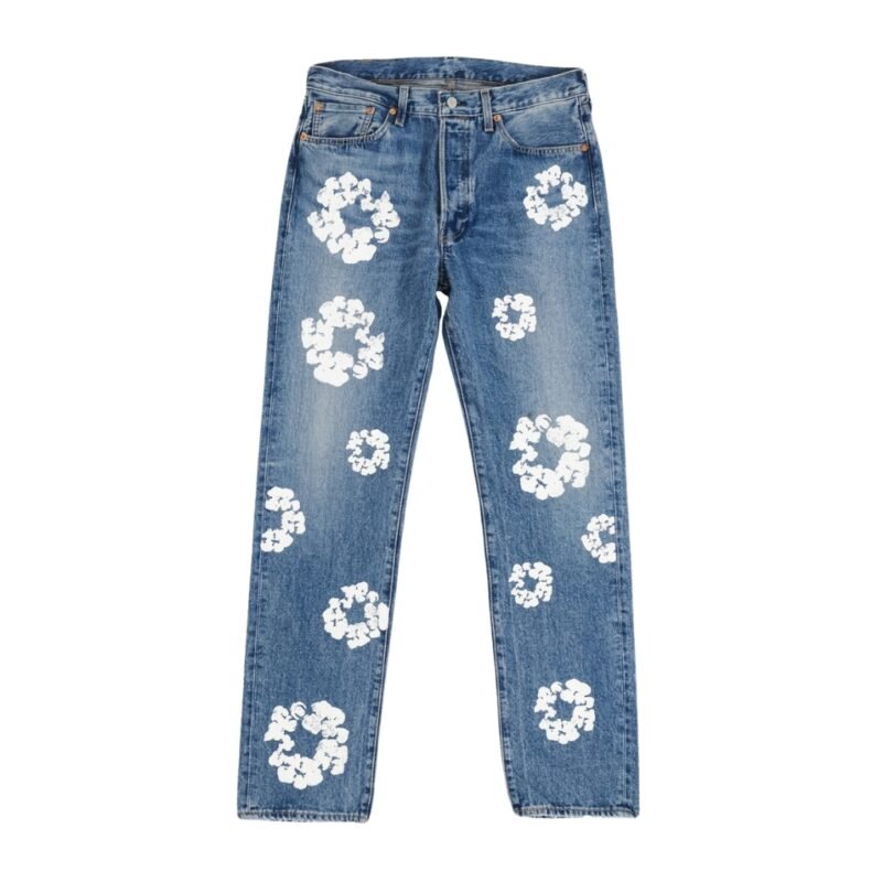 Washed blue straight-leg jeans with white floral designs scattered across the front, centered on a white background.