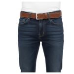 Full-grain leather belt in a model view, worn with dark blue jeans.